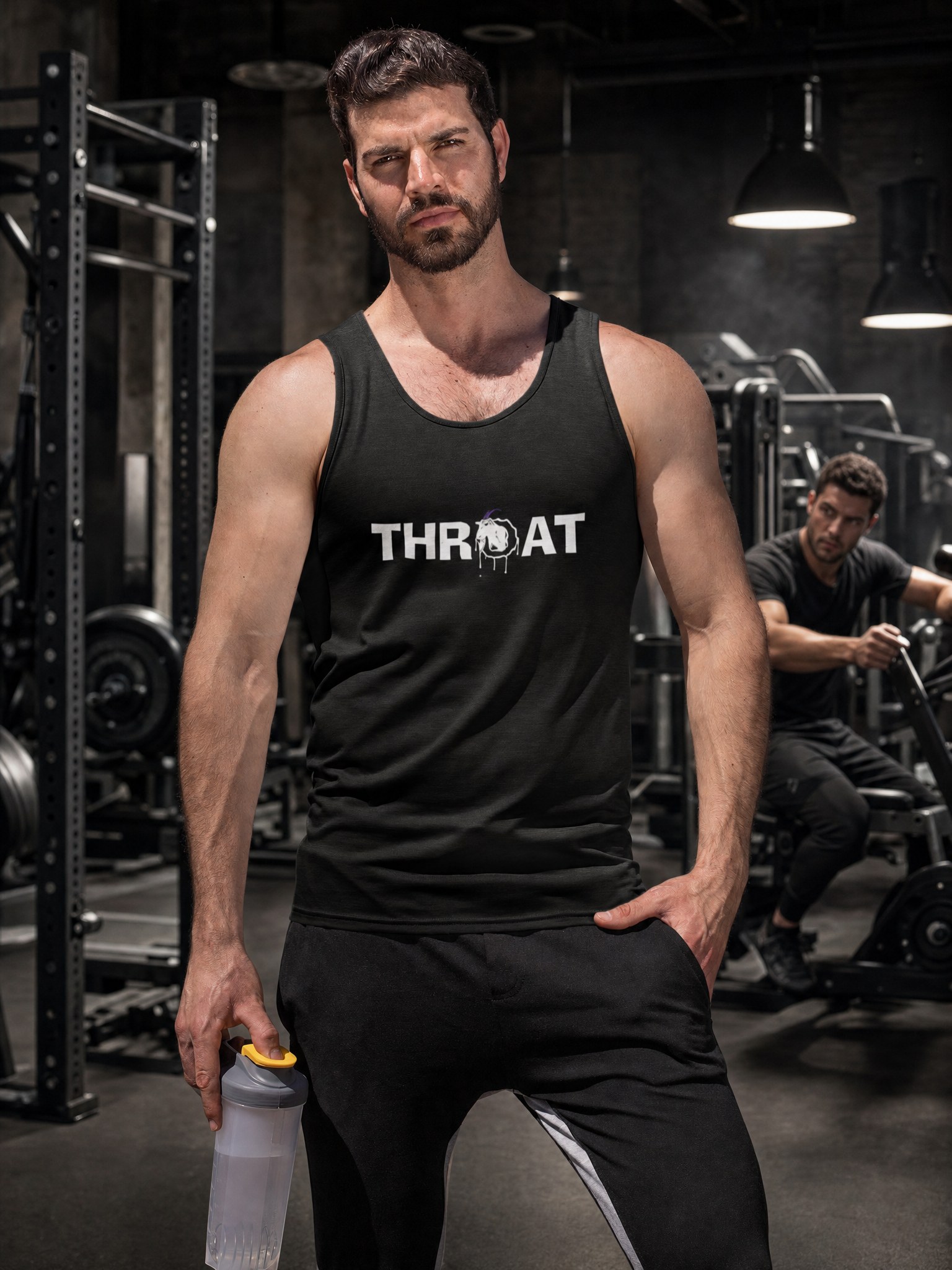 Model in a black THROAT workout tank in an industrial gym