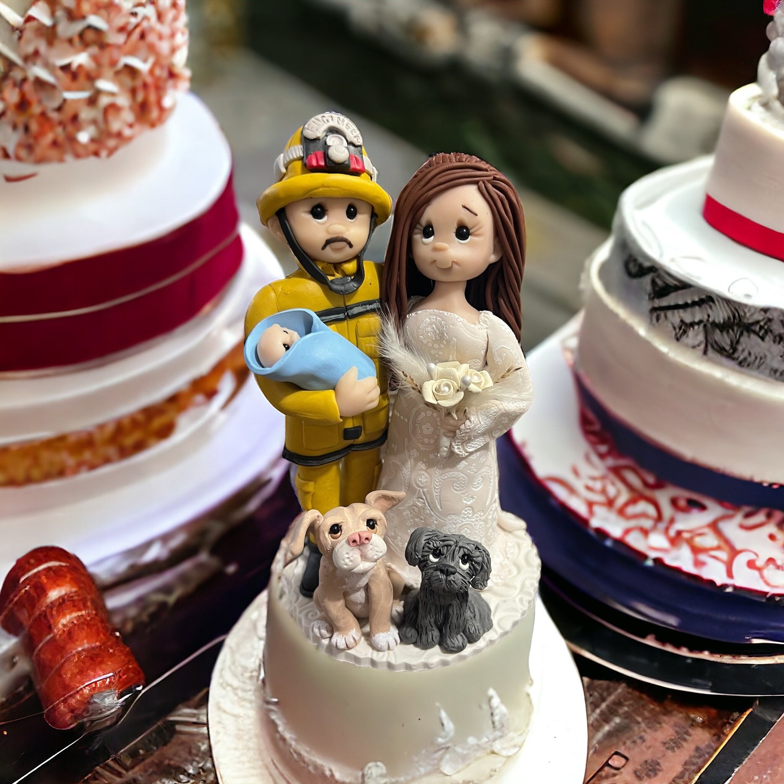 Personalized Wedding Cake Topper with Bride, Fireman Groom with Baby and 2 dogs by Lynn's Little Creations