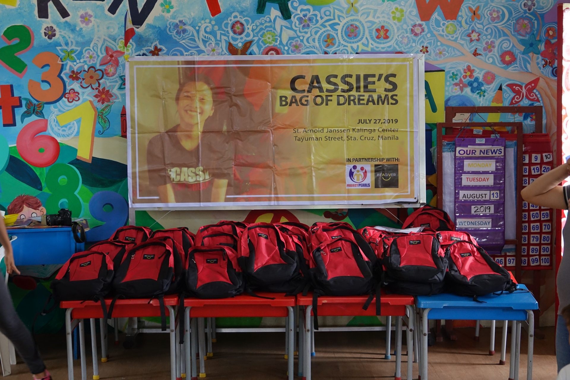 Students receiving Cassie's Bag of Dreams backpacks