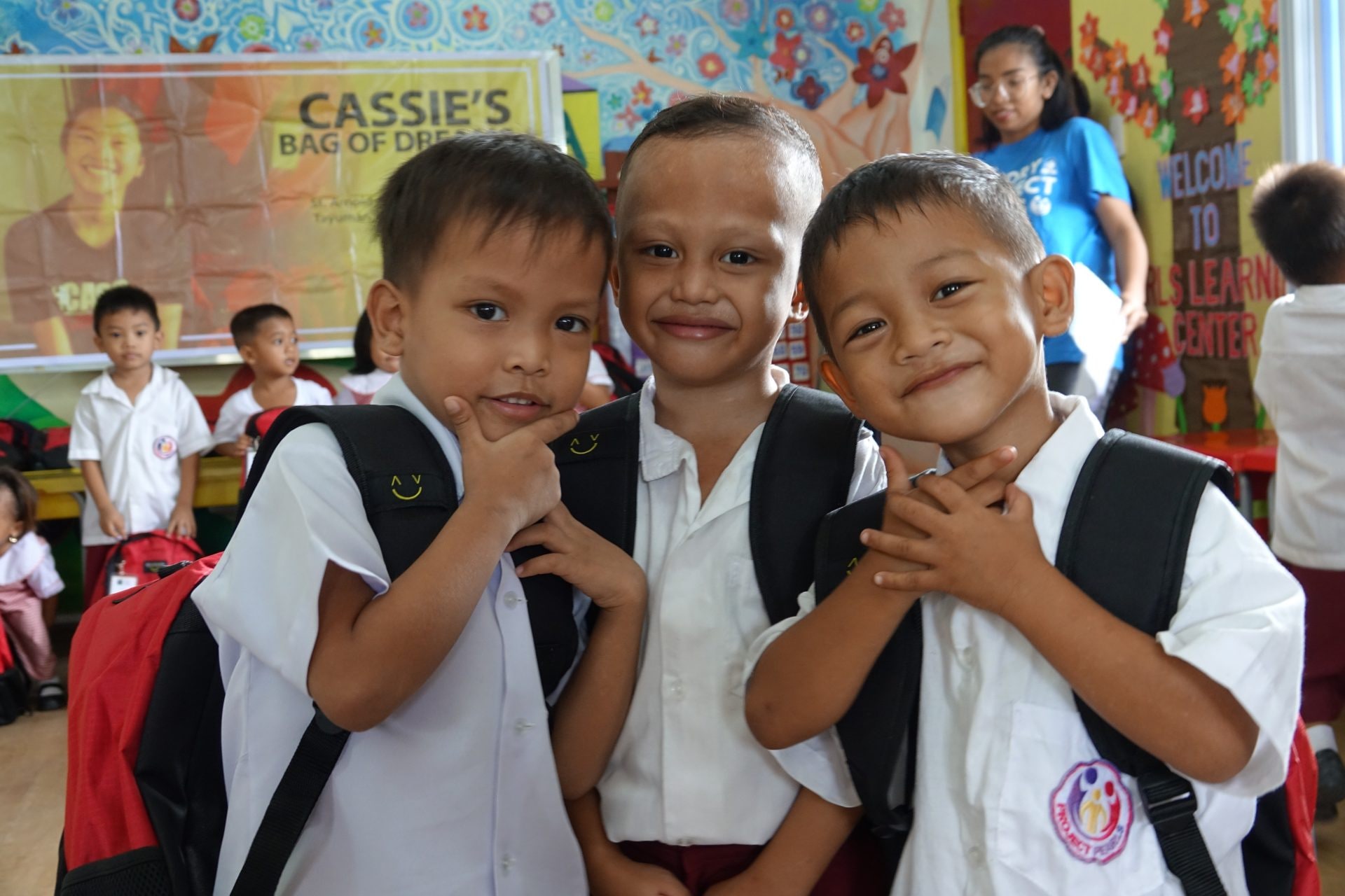 Children celebrating their new school supplies