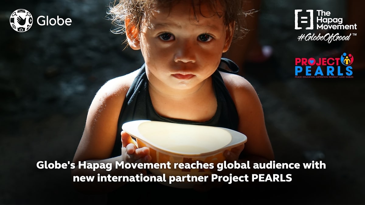 A child with a meal in a Globe Hapag Movement and Project PEARLS feature