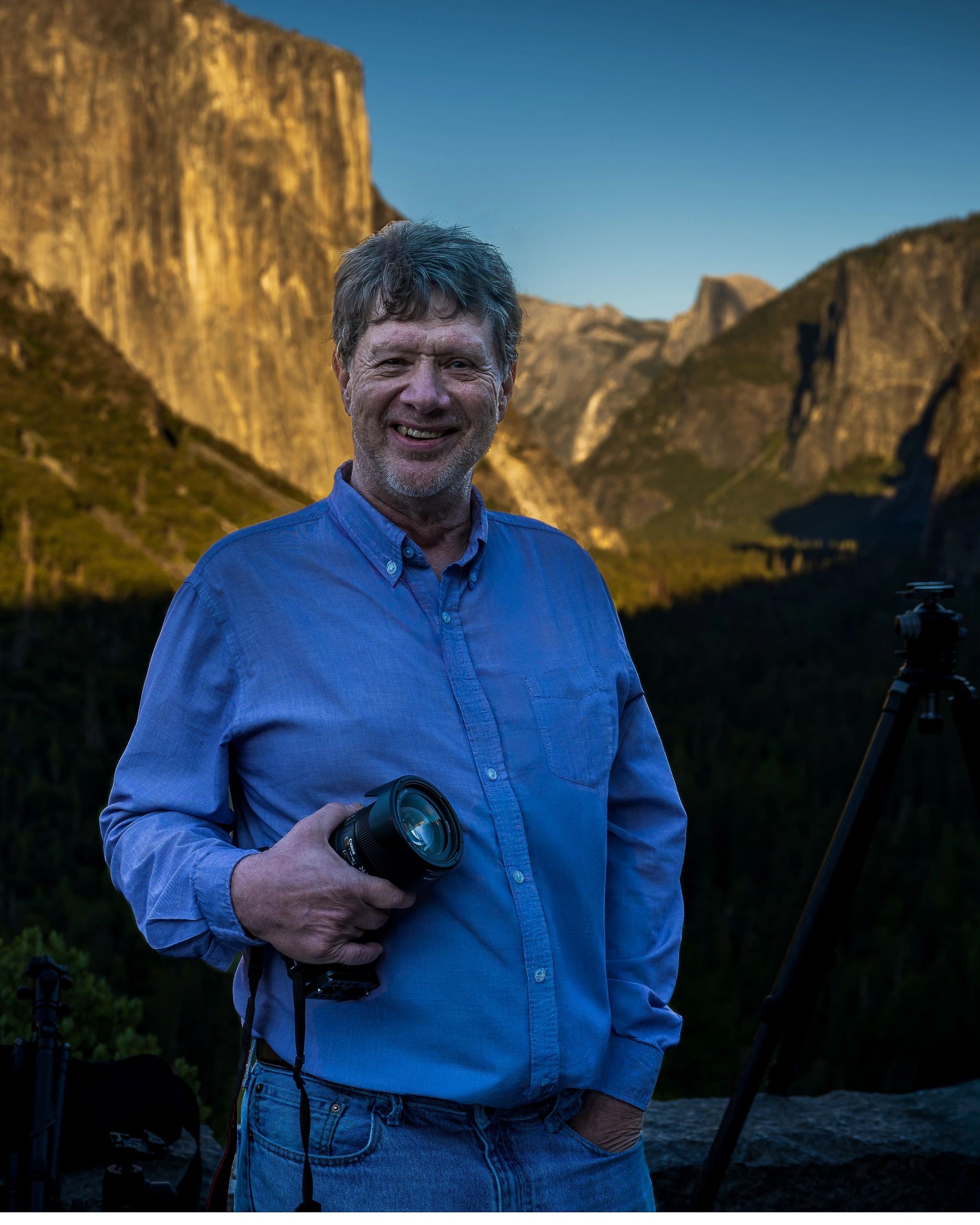Joseph Metzler holding a camera in Yosemite