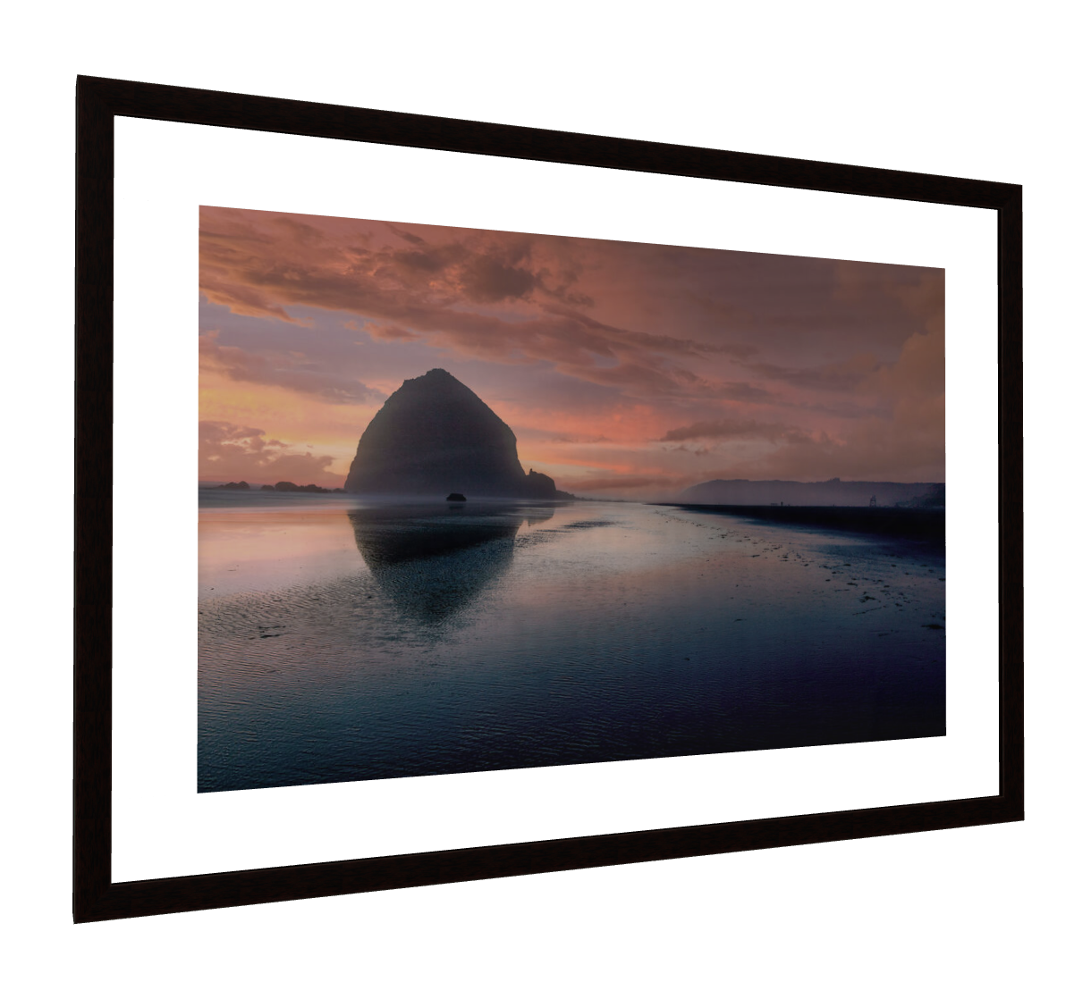 Cannon Beach photograph with a white mat in a dark wood frame