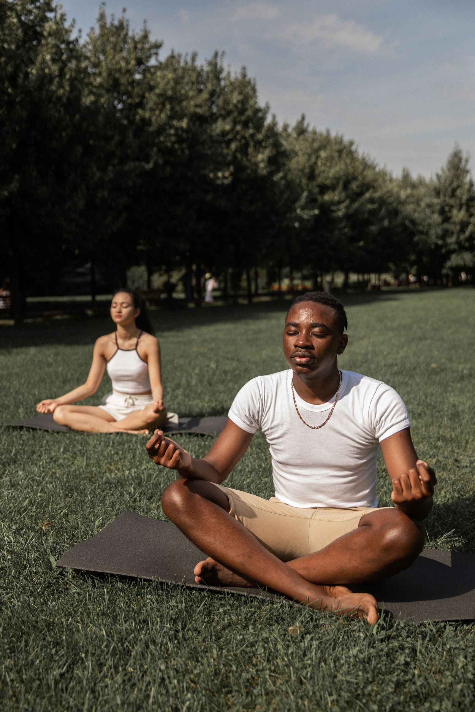 Couple taking a quiet grounding pause together in a park