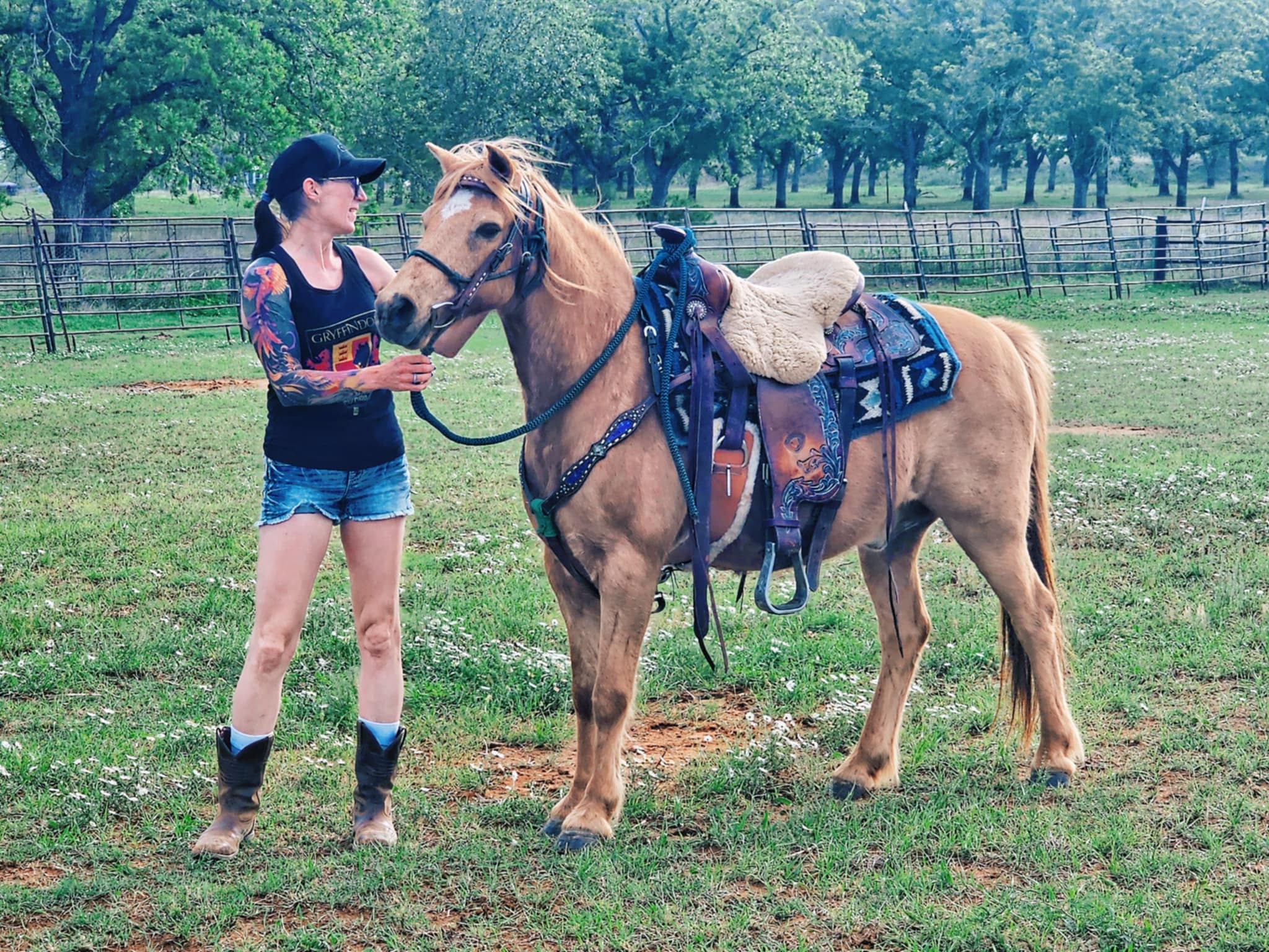 Nadine standing beside Loui in a pasture