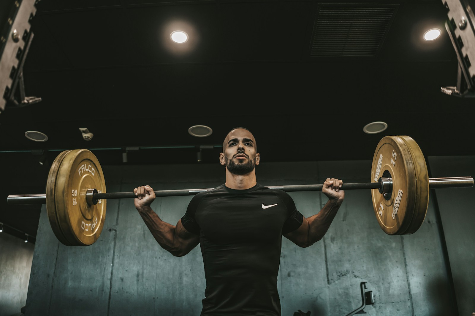 Athlete holding a shaker after a strength-training session