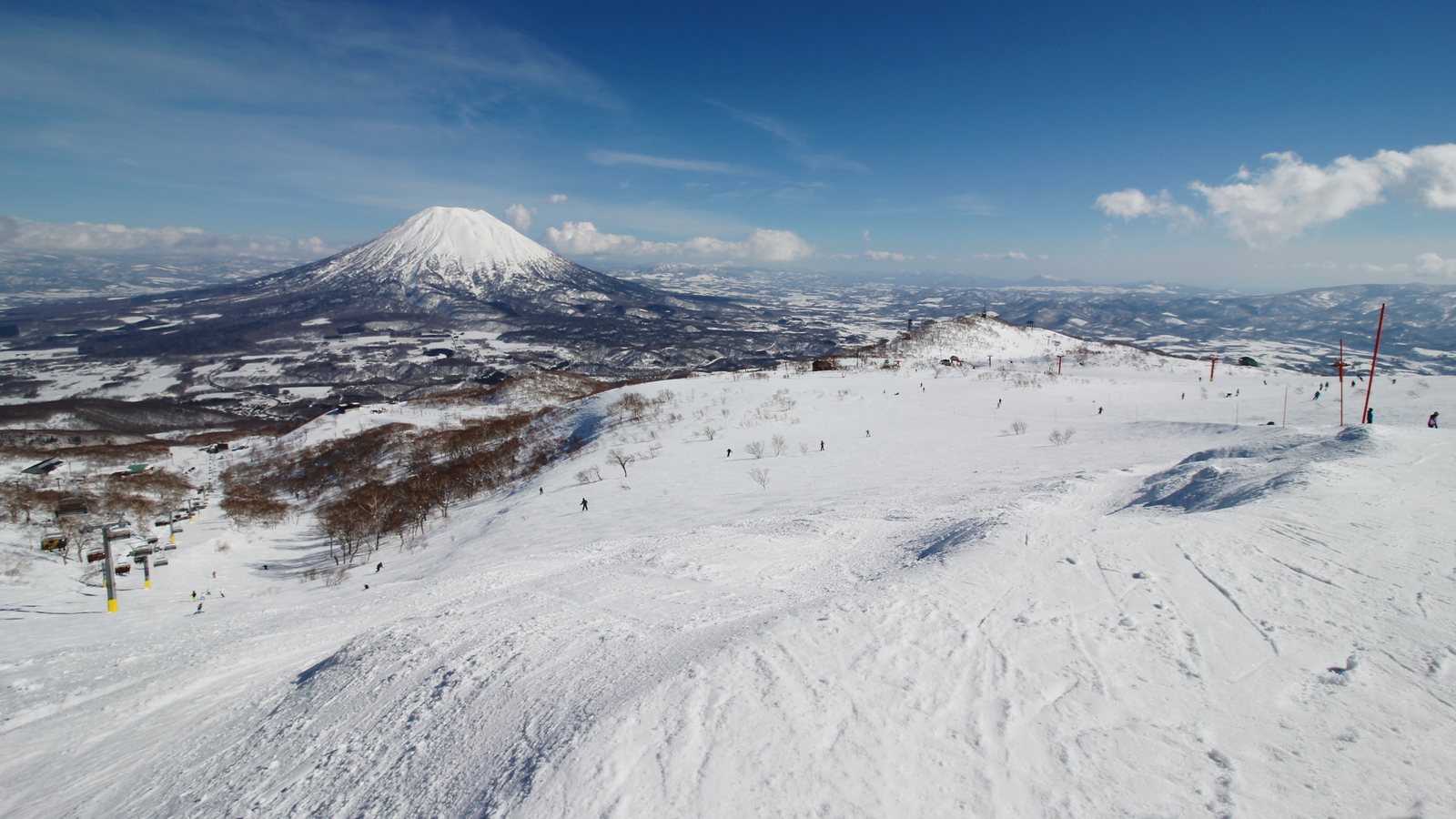 Mount Yotei rising beyond the snow-covered ski slopes at Niseko, Japan