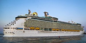 Cruise ship sailing at sunset
