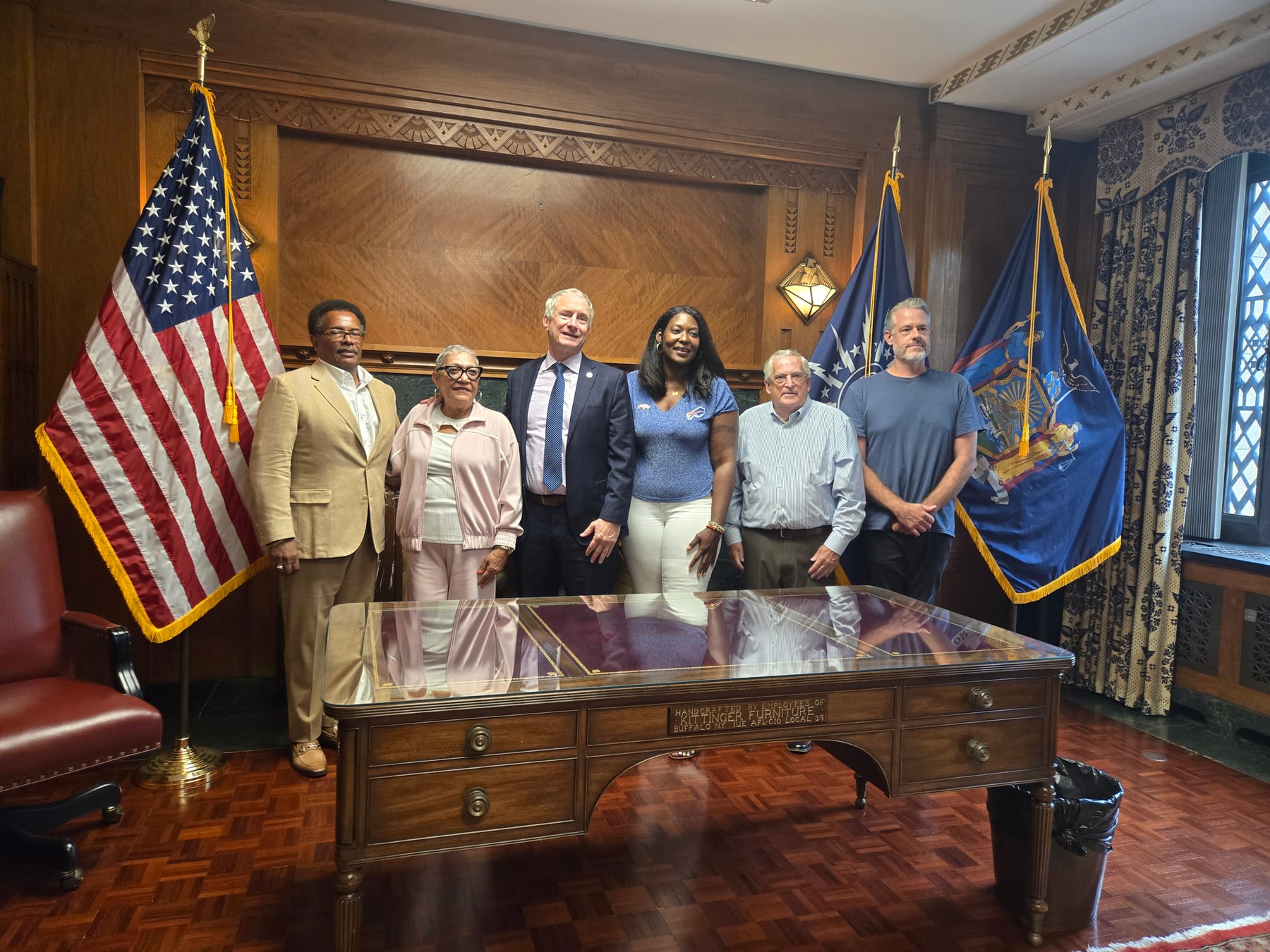 Garnell Whitfield, Rev. Sharon Risher, Mayor Sean Ryan, Councilmember Zeneta Everhart, Paul McQuillen, and Scott Langley standing together in the Mayor's office.