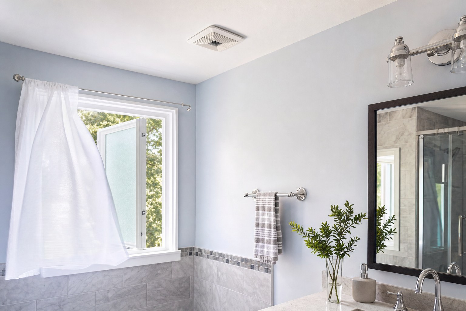 Freshly painted bathroom airing through an open window and exhaust vent