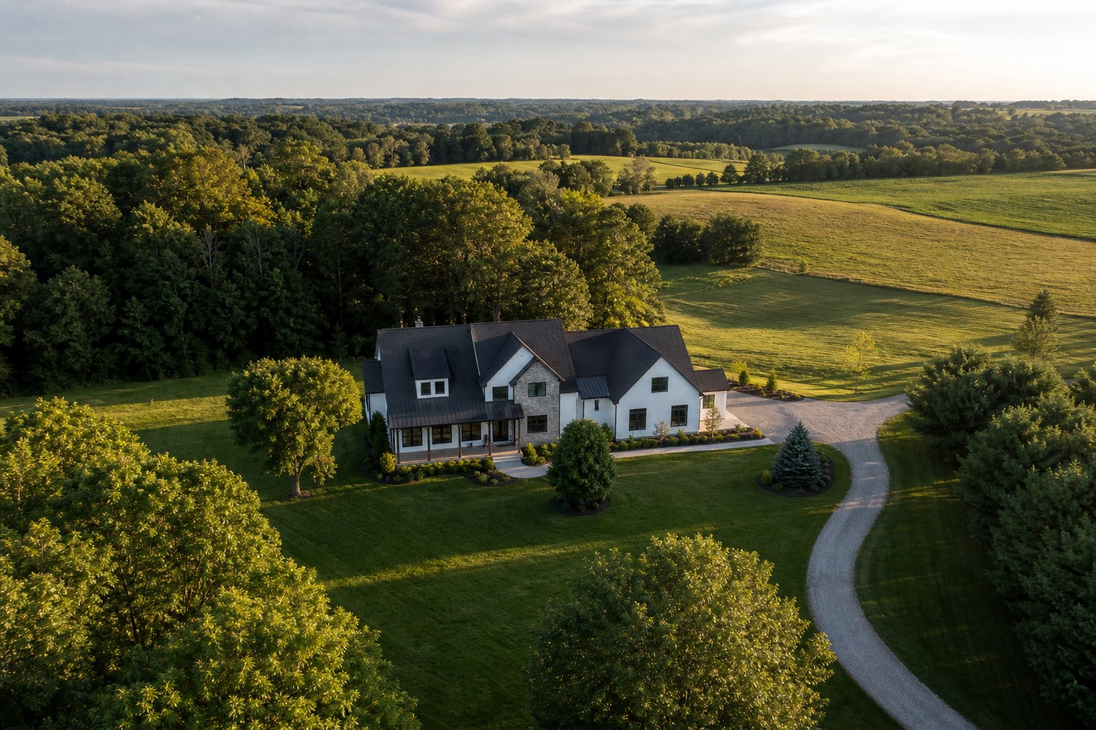 Aerial view of a home and its surrounding acreage