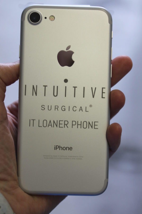 An engraved iPhone marked as an IT loaner phone