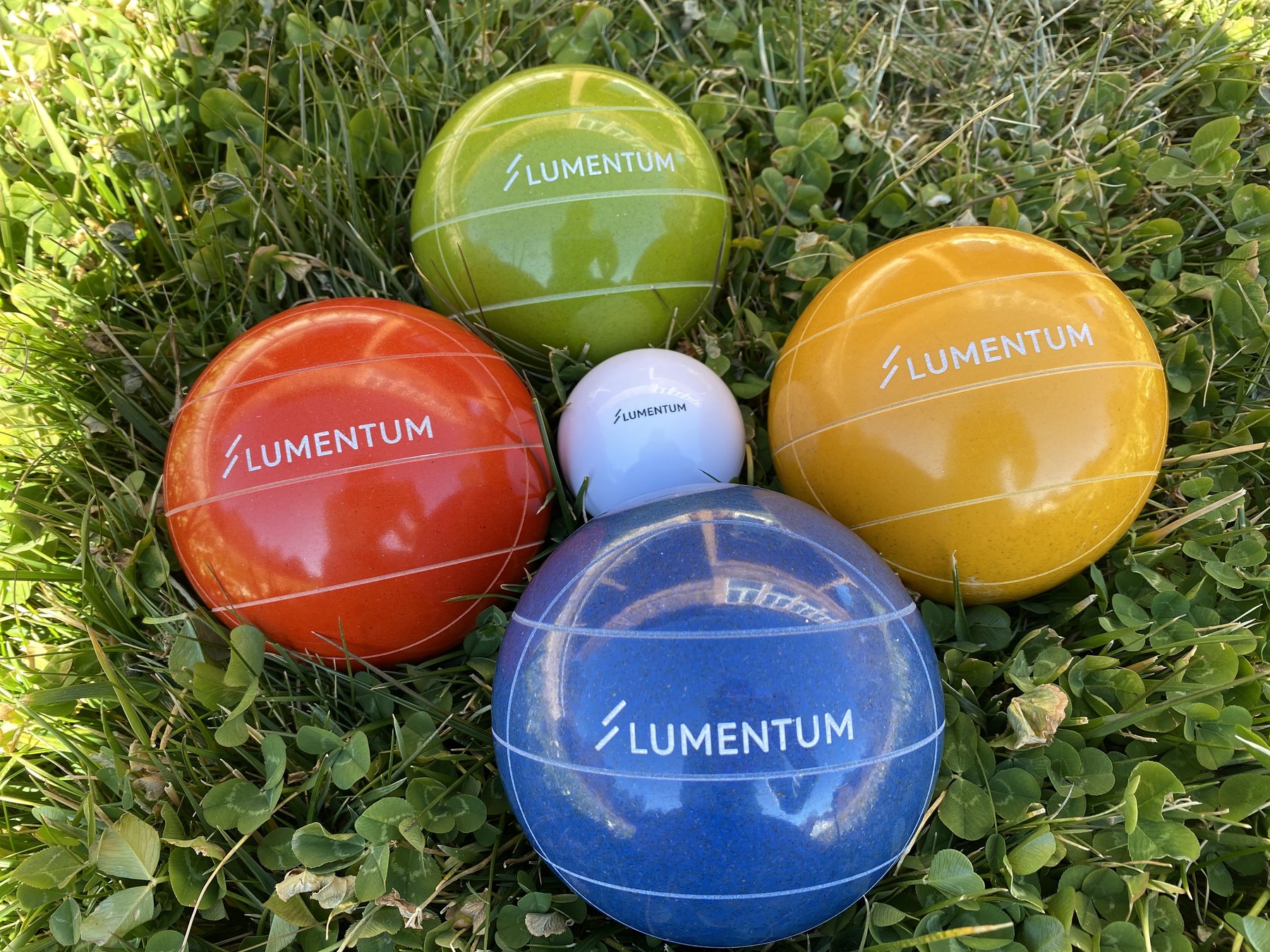 A colorful set of custom-branded bocce balls