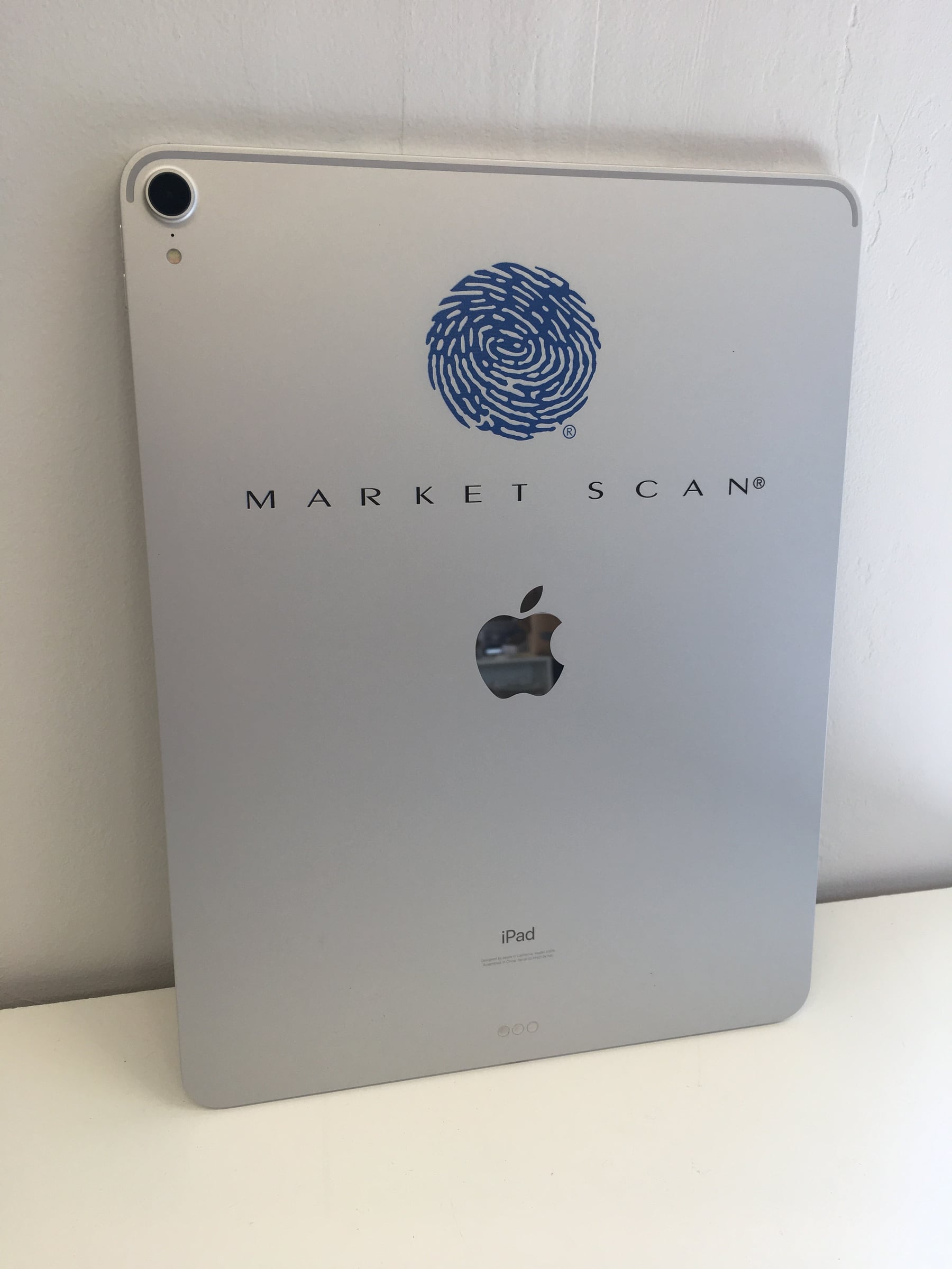 A custom-branded iPad with a laser-marked MarketScan logo