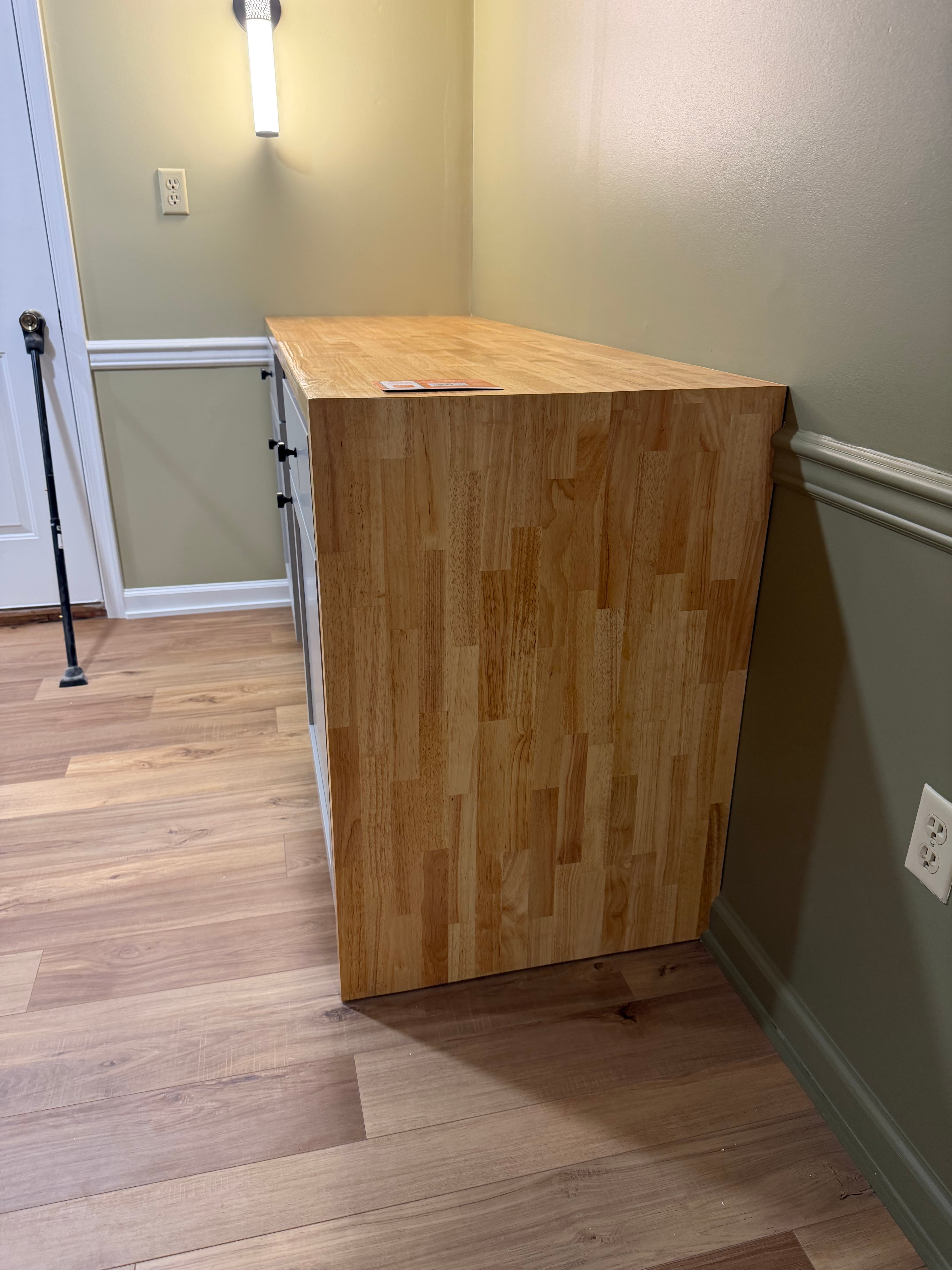 Butcher block waterfall edge over new basement cabinetry