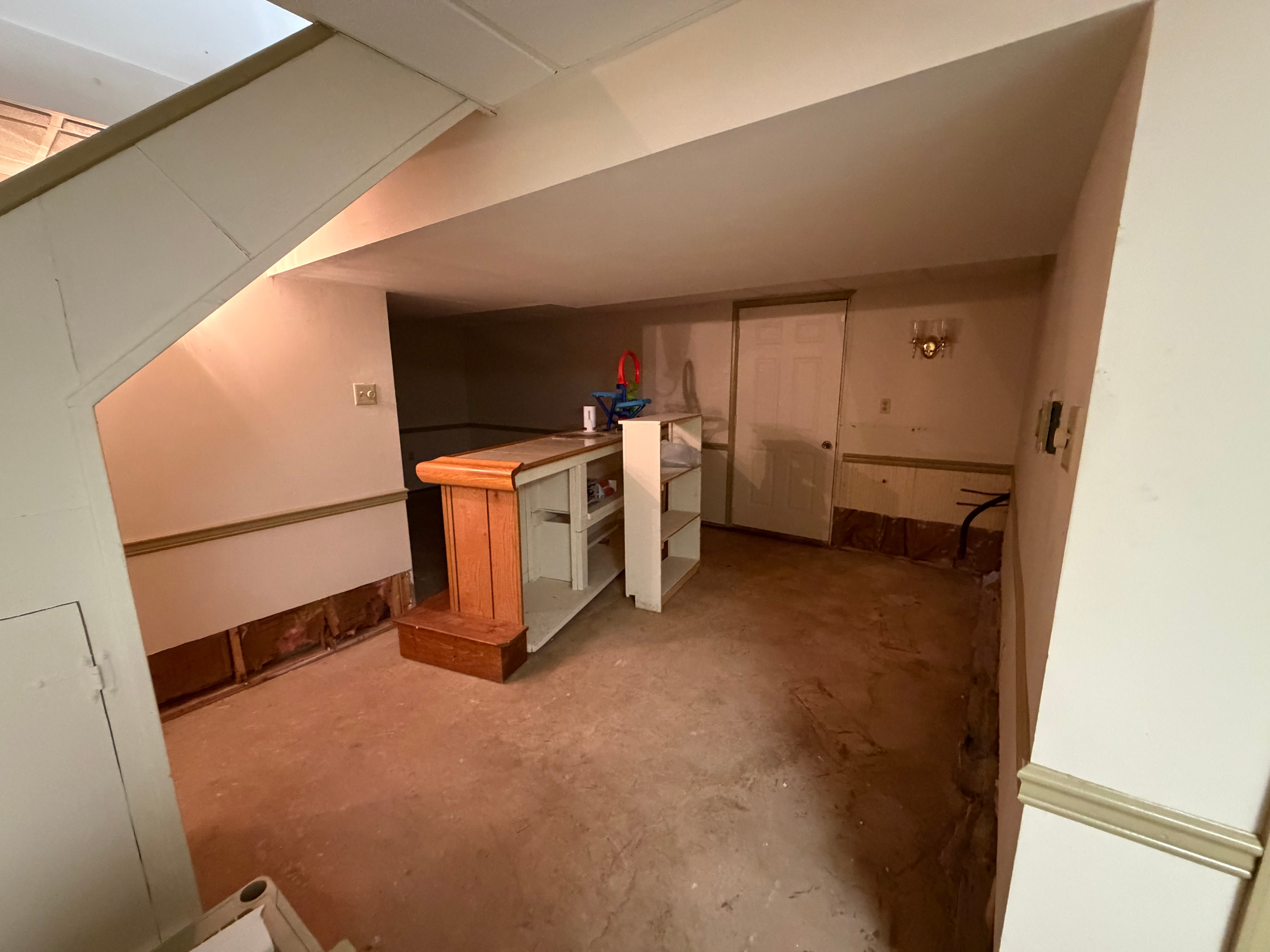 Existing basement room before renovation