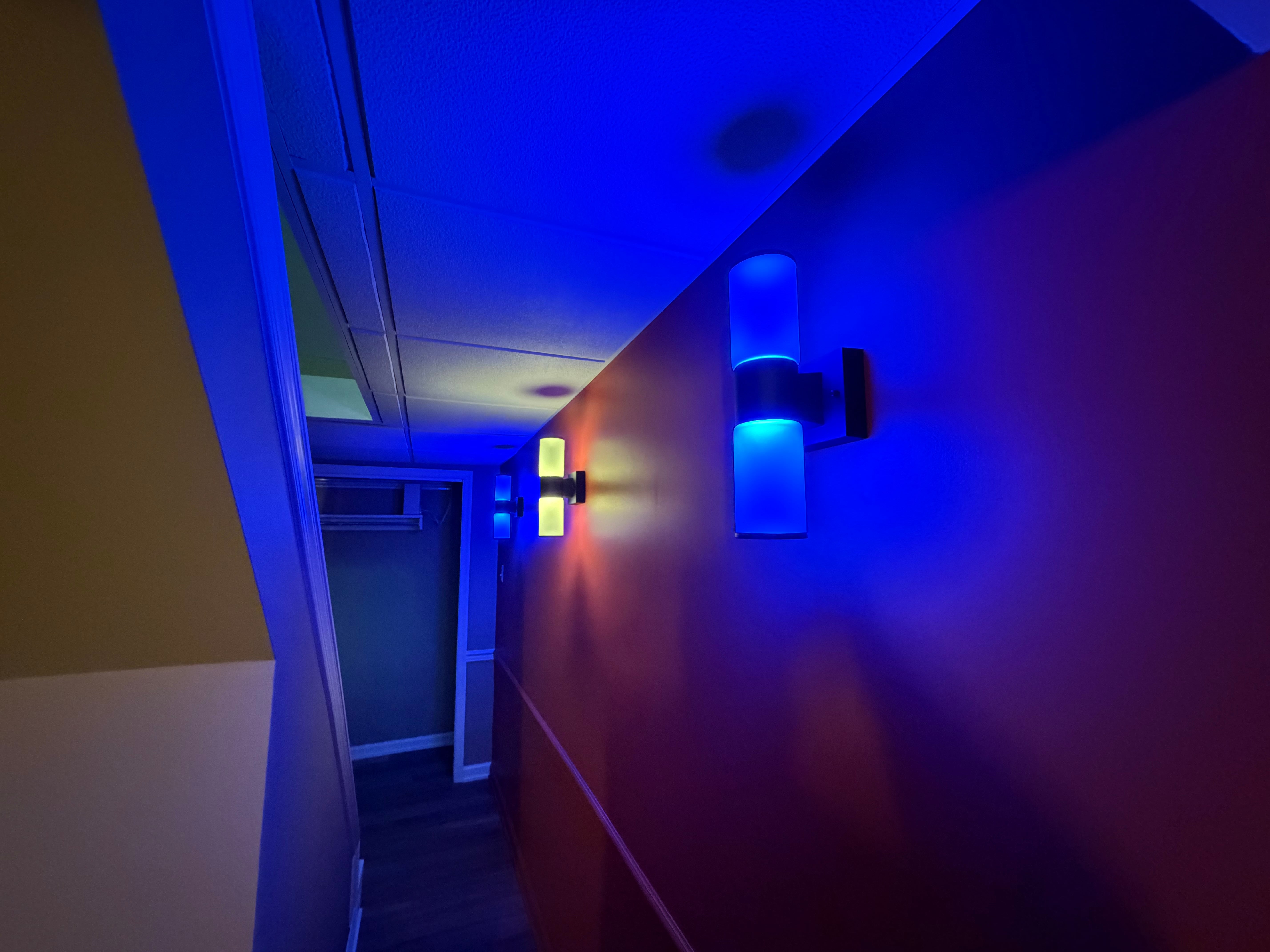 Finished basement with layered ceiling lighting and a comfortable living area