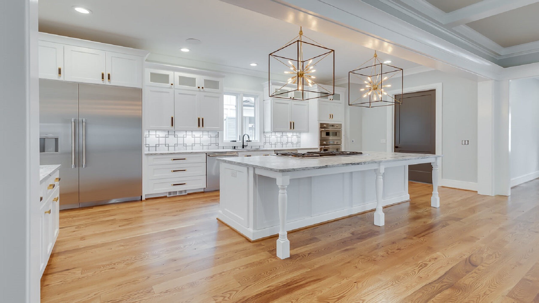 Bright kitchen cabinetry showing a straight base cabinet run