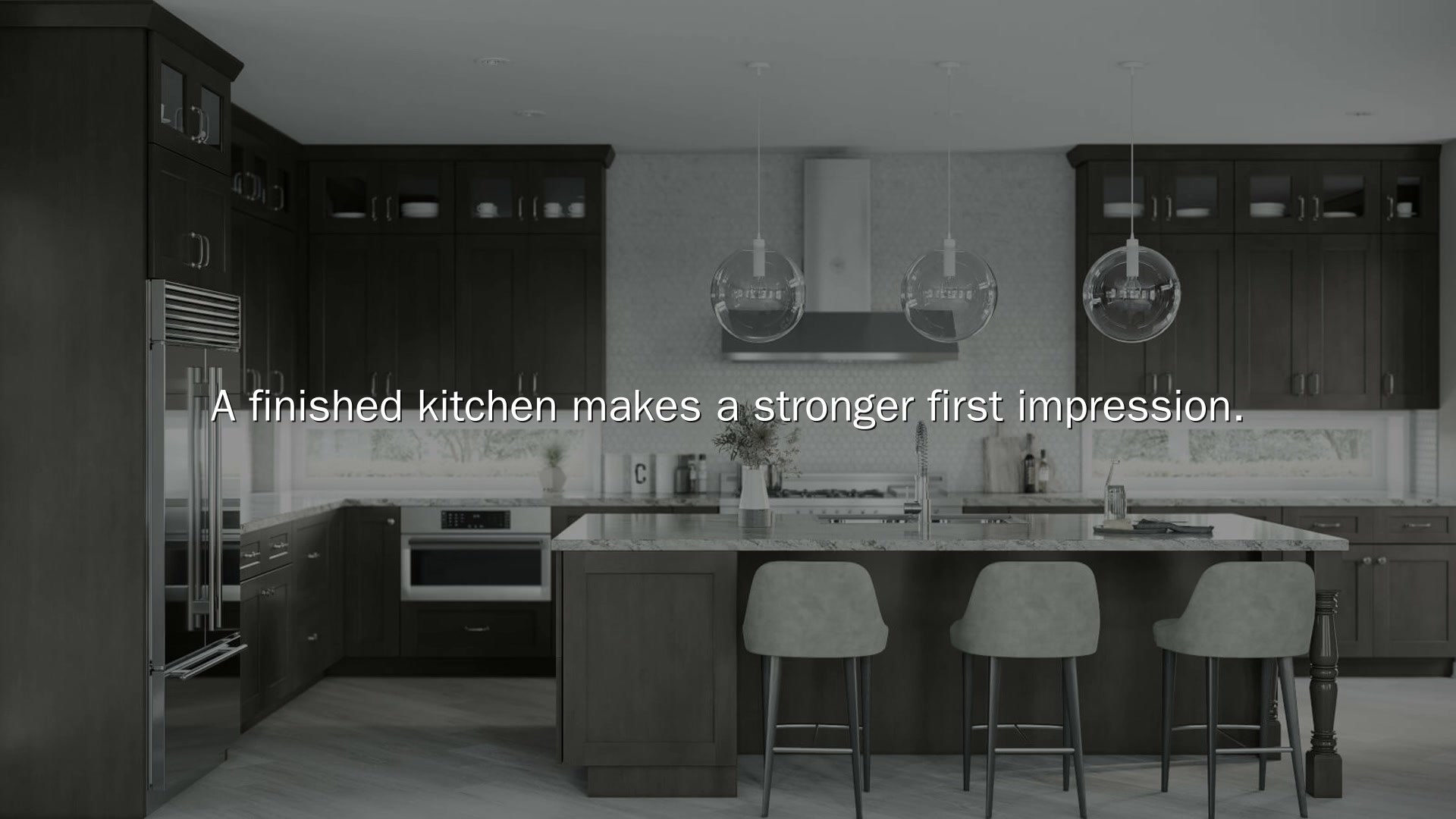 Finished kitchen with dark cabinetry and a center island