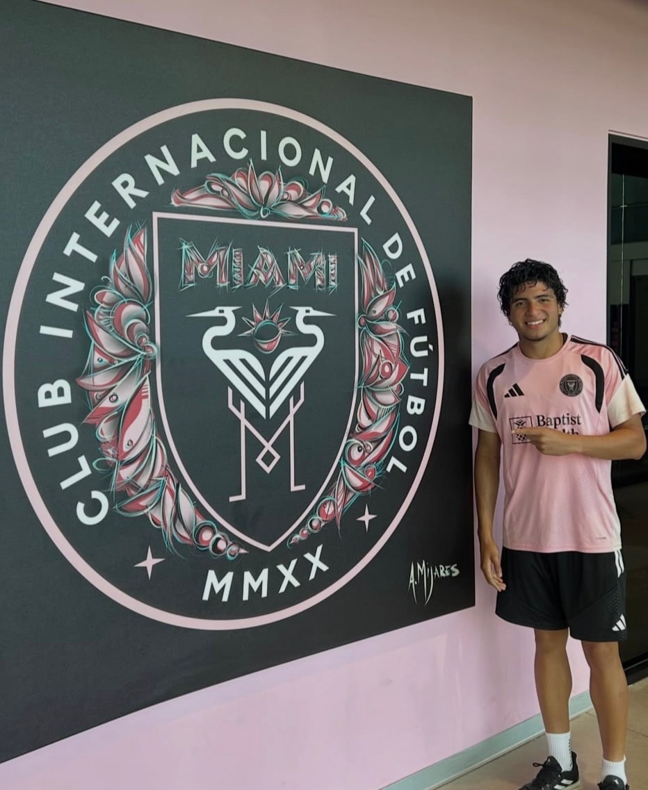 Isaiah Vicentti wearing an Inter Miami CF jersey beside the club crest