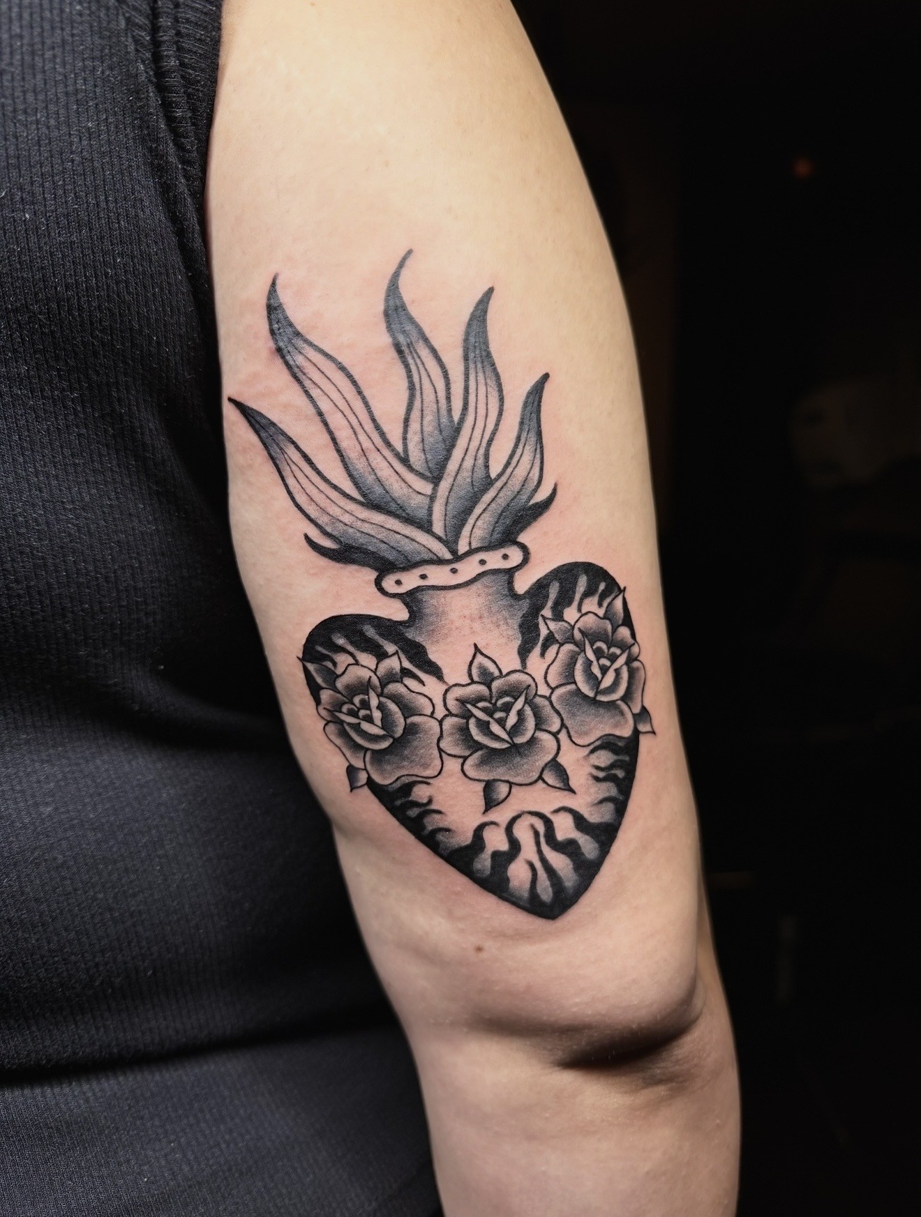 Floral dagger tattoo shaped to follow a client's arm