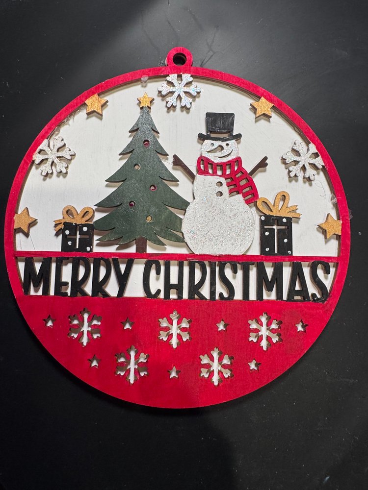 Handmade Merry Christmas decoration with a snowman and tree