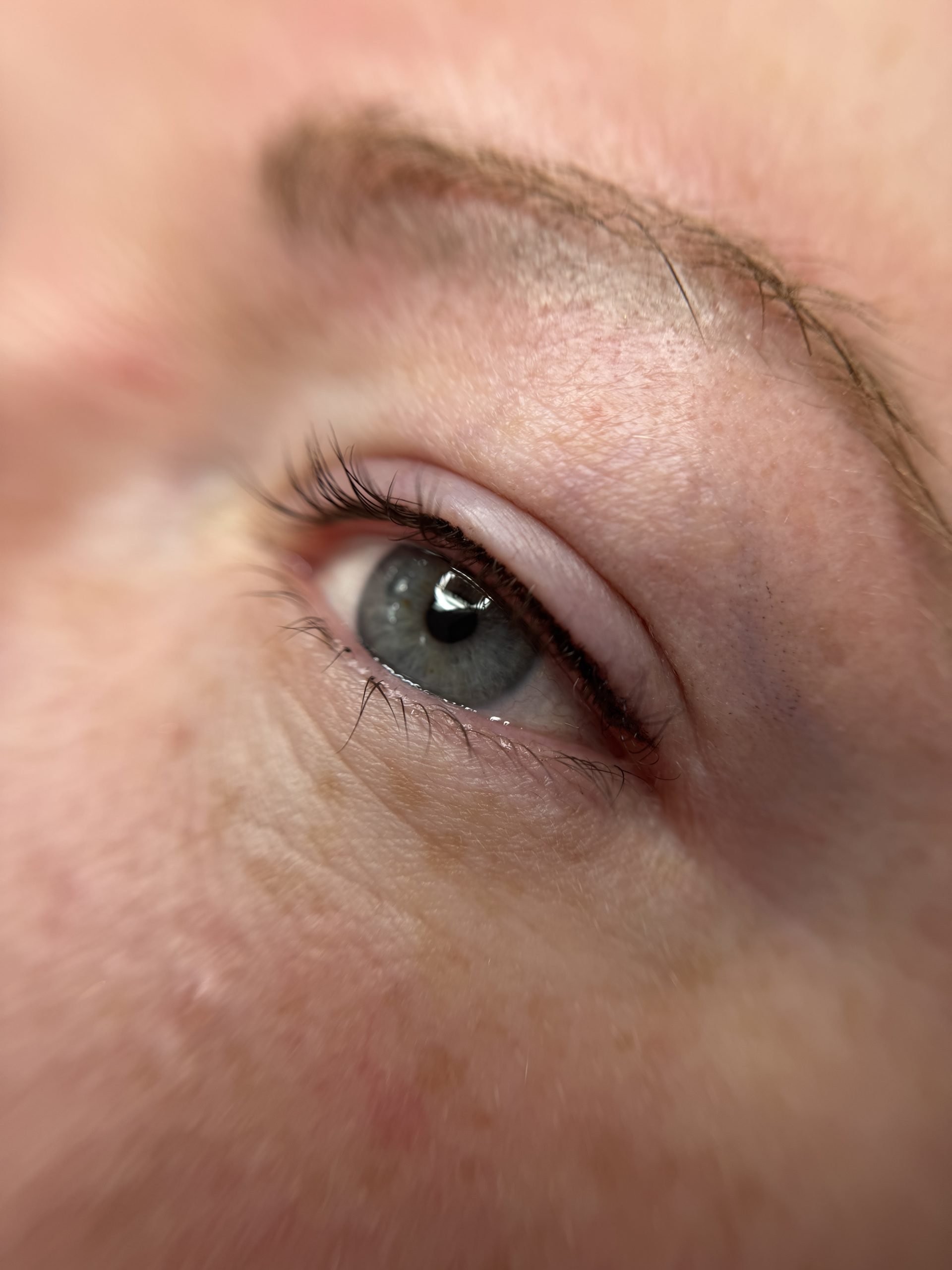 Close-up of subtle lash line enhancement