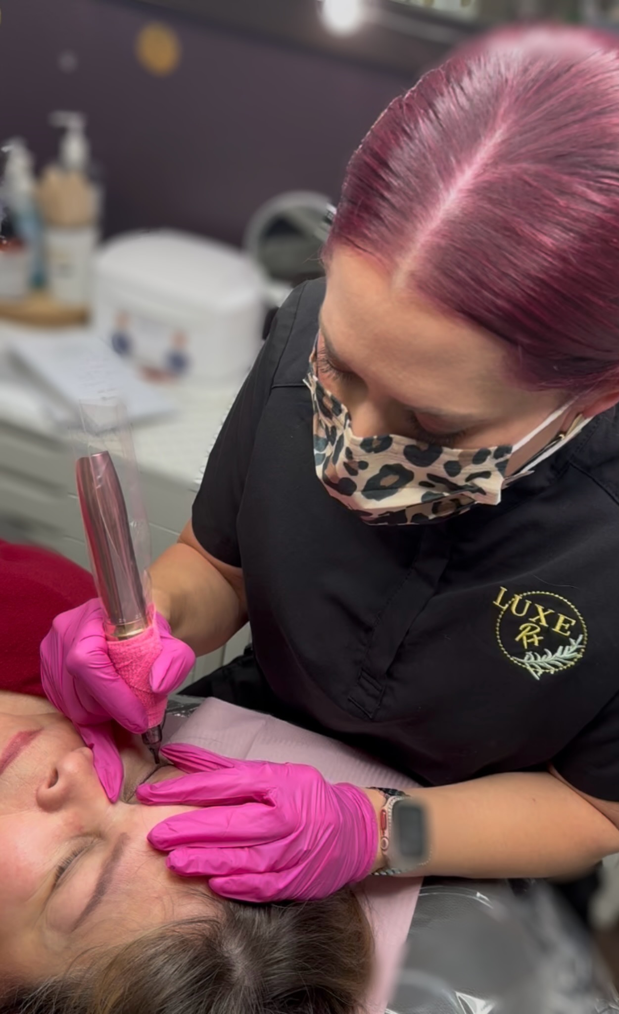 Christina Morgan at work with a client at LUXE Brow + Lash