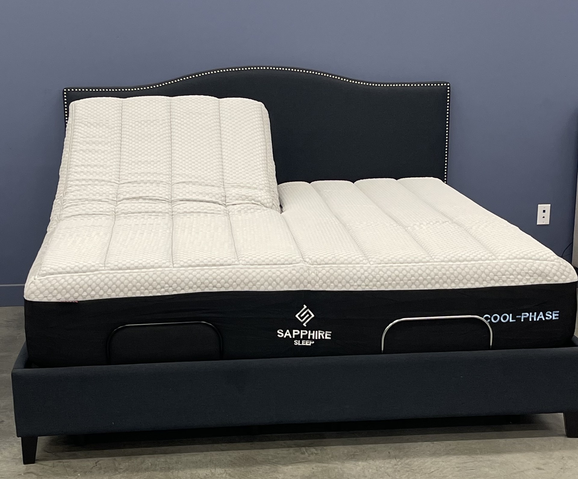 A Sapphire Sleep Cool-Phase Hybrid mattress raised on an adjustable base.