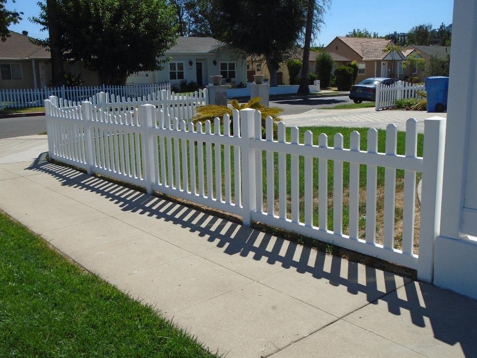 White vinyl picket fencing by All Season Fencing