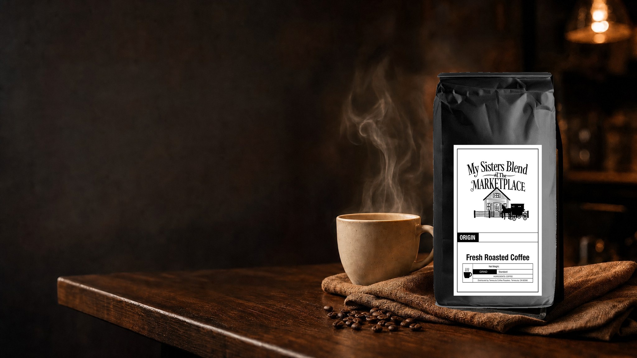 Steaming coffee beside a My Sisters Blend coffee bag on a walnut counter