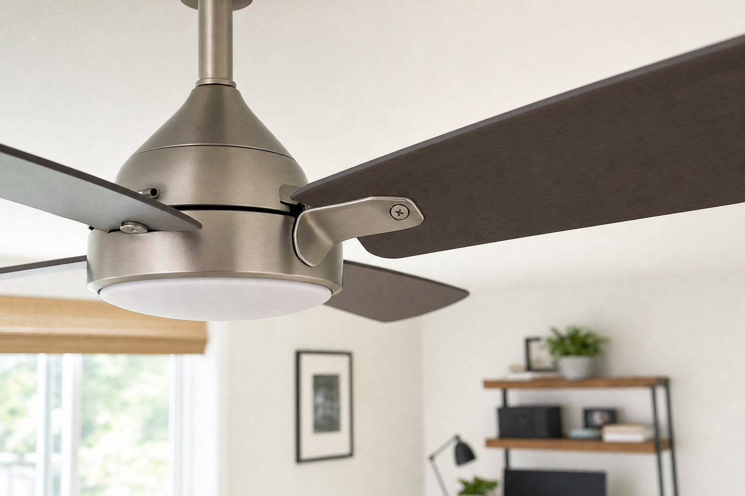 Close view of stationary ceiling fan blades, blade arms and accessible screws