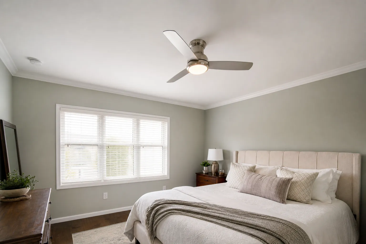 Ceiling fan with light in a bedroom