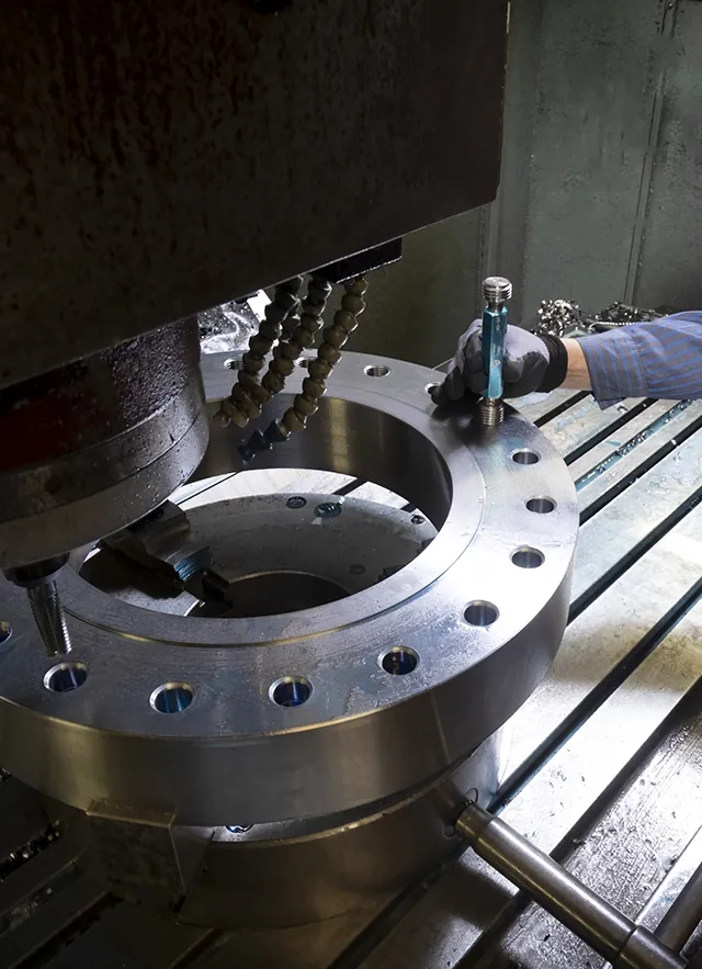 Machined metal fitting during a precision manufacturing operation