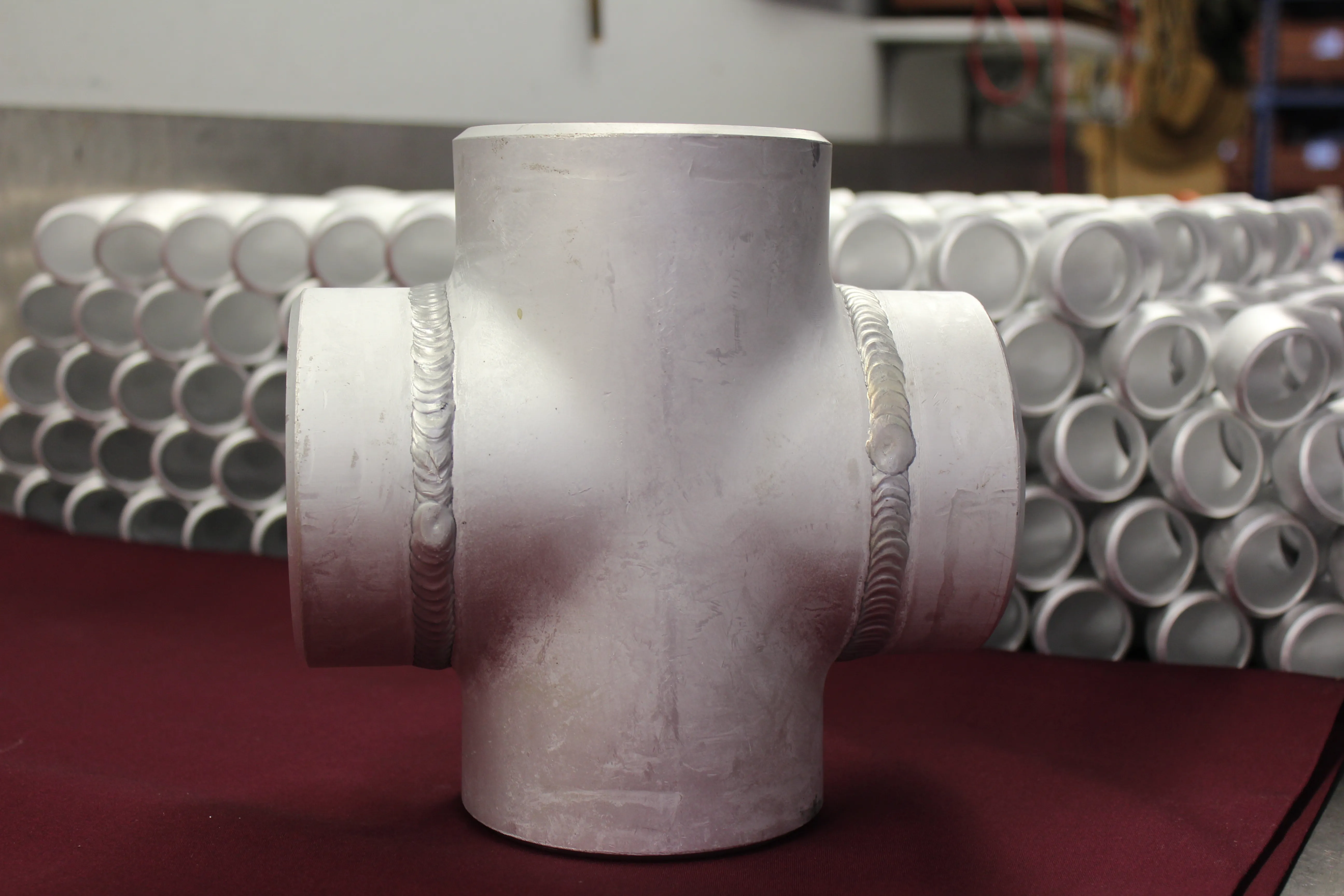 Custom aluminum tee fitting with visible welded branches