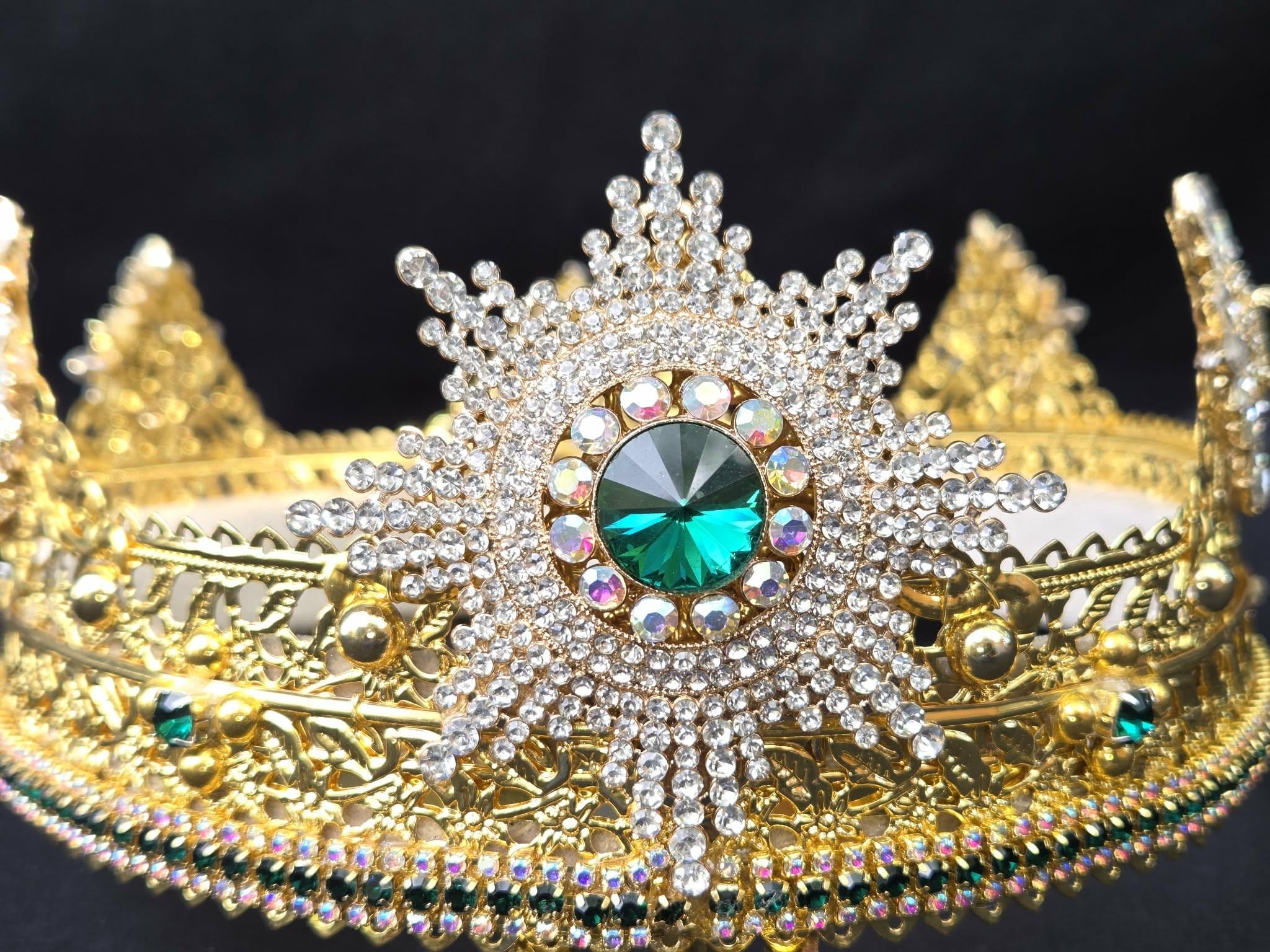 Emerald Starburst gold crown with a green centerpiece and sparkling rhinestones