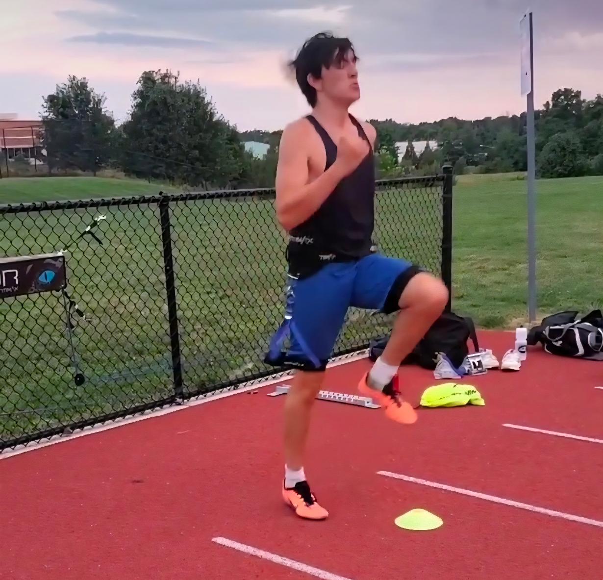 Virginia Pride athlete practicing high-knee running mechanics on an outdoor track