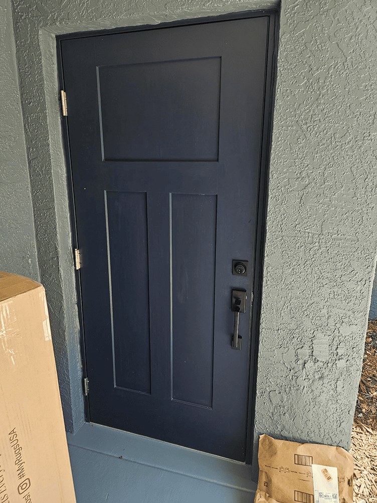 Entry door before faux wood finishing