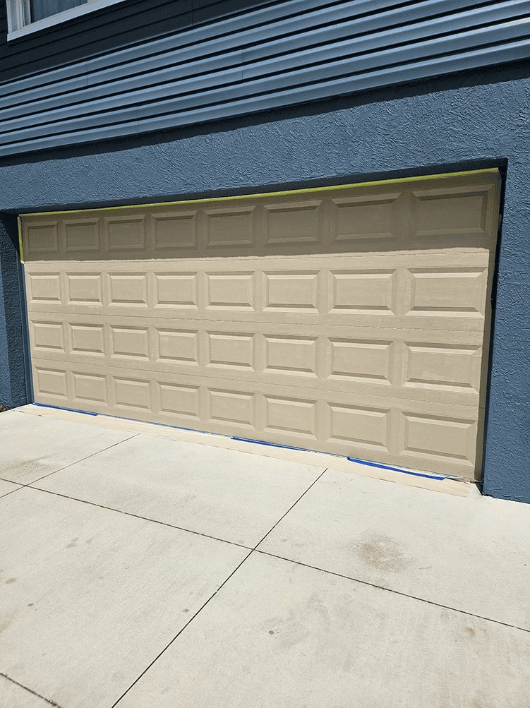Garage door before faux wood finishing