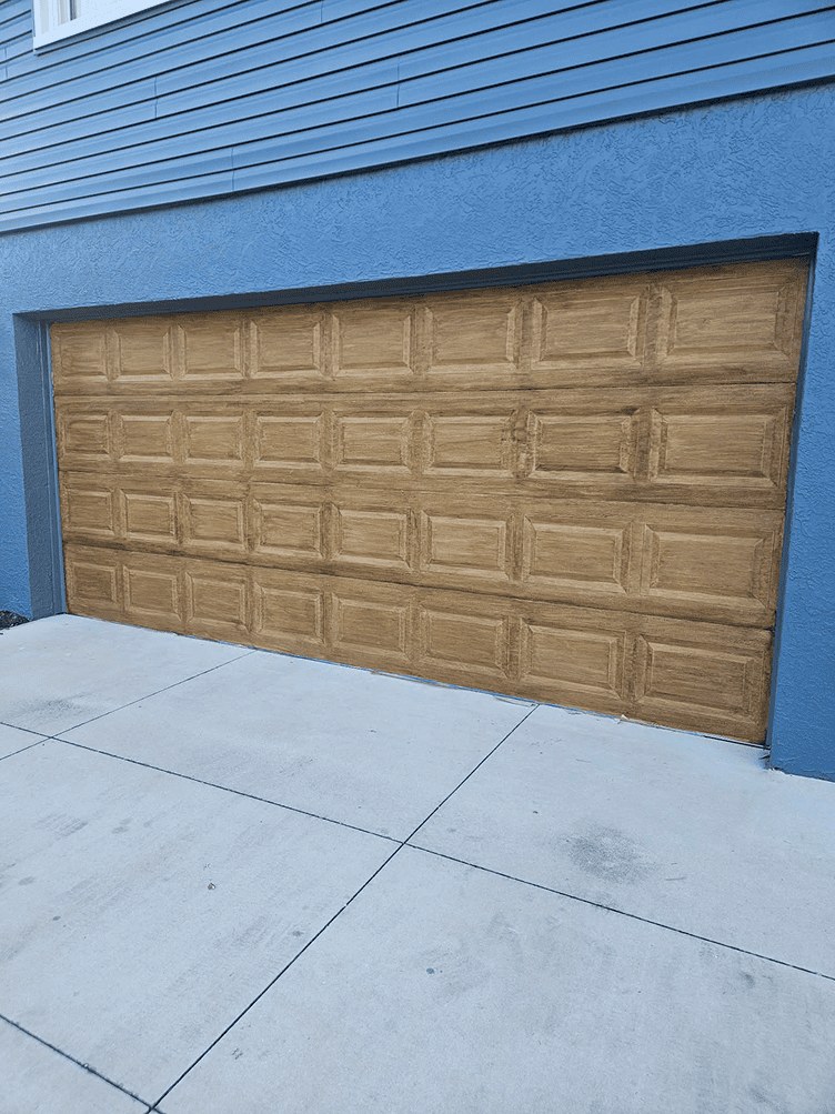 Garage door after faux wood finishing