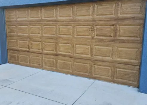 Warm wood-look garage door on a Florida home