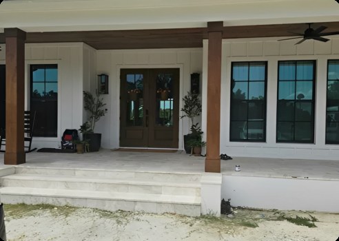 Florida home entrance with a warm wood-look garage door