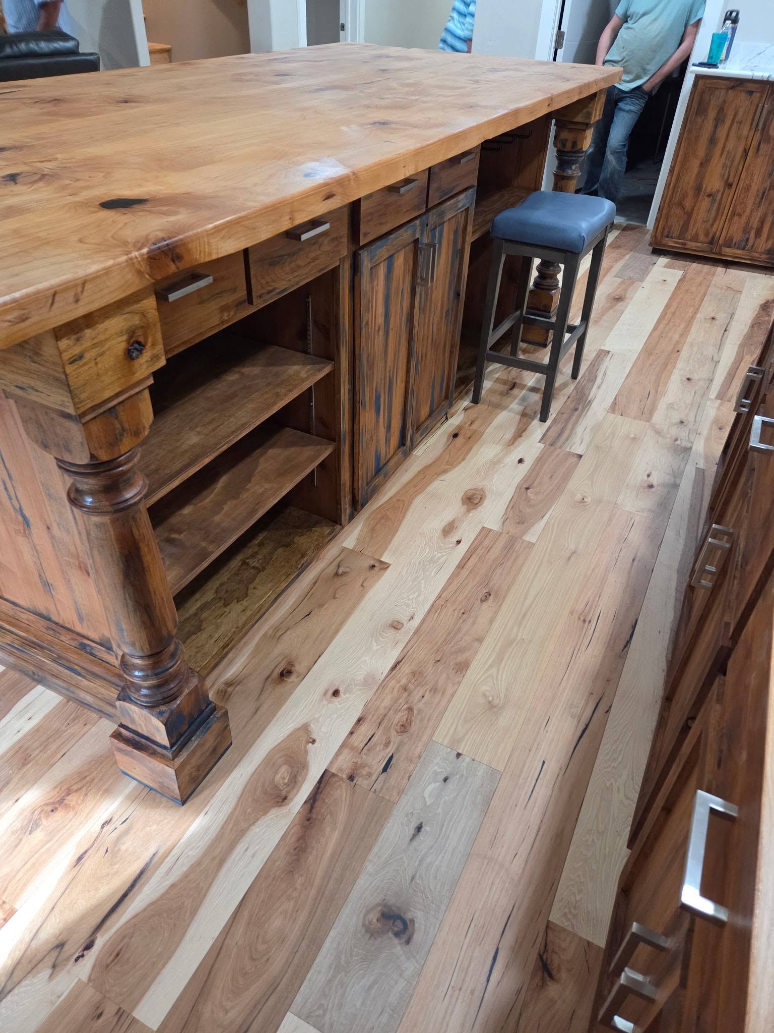Finished custom kitchen island with a warm wood worktop
