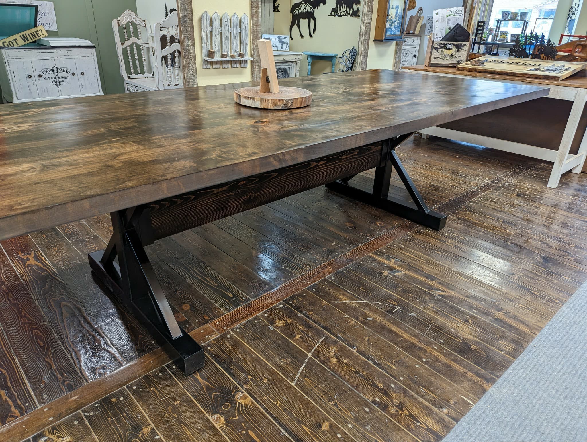 Custom dining table with steel trestle base