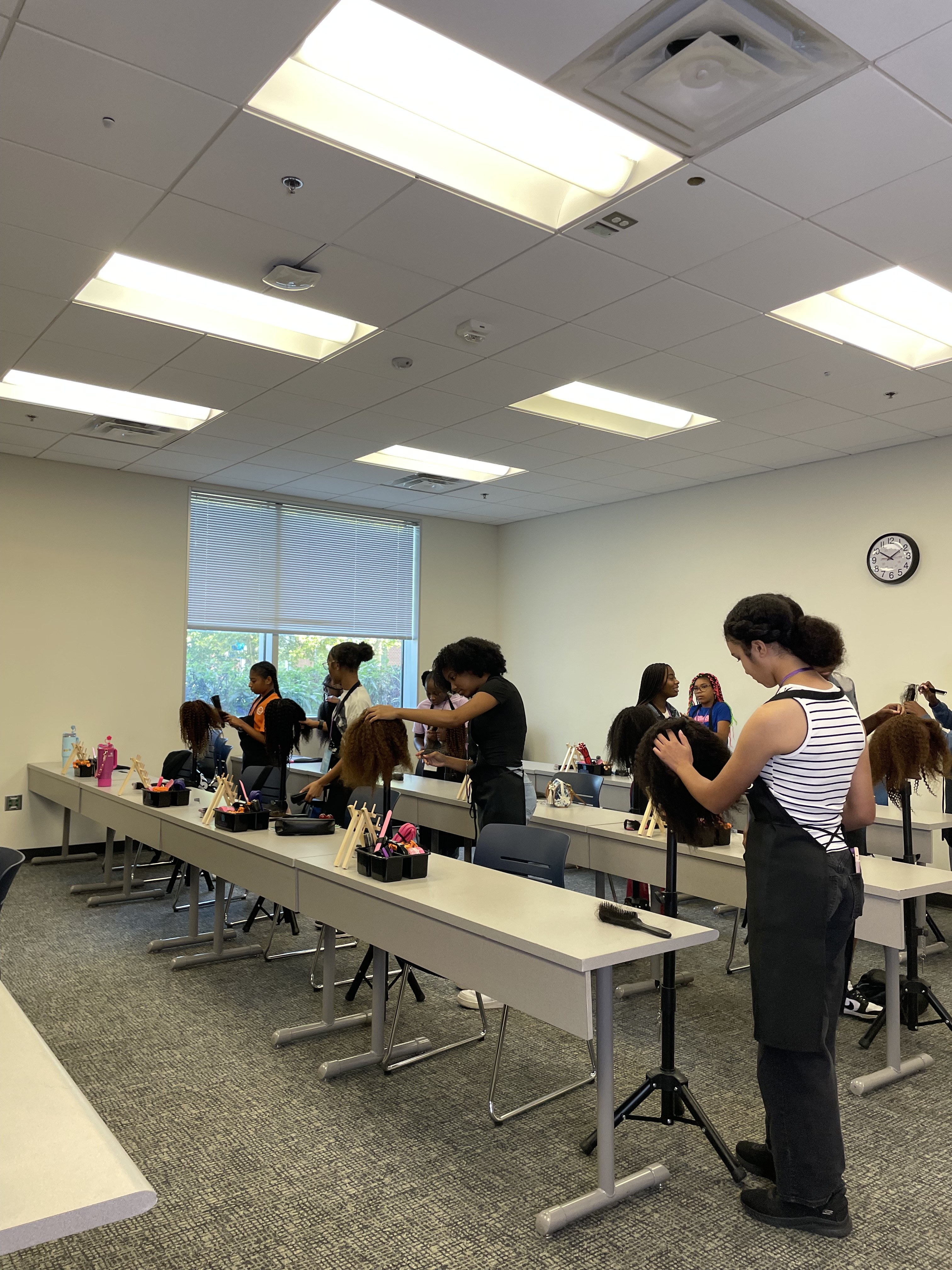 Youth Braid and Business Academy instructor leading a classroom session