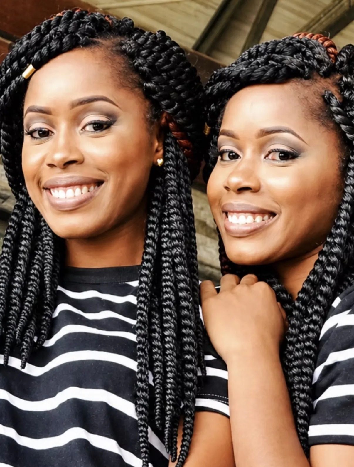 Two Youth Braid and Business Academy students wearing braided styles