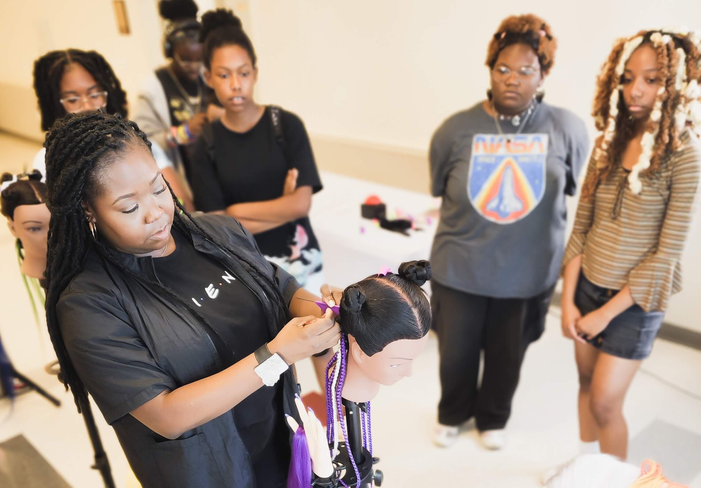 Youth learning and working together in a supportive program setting