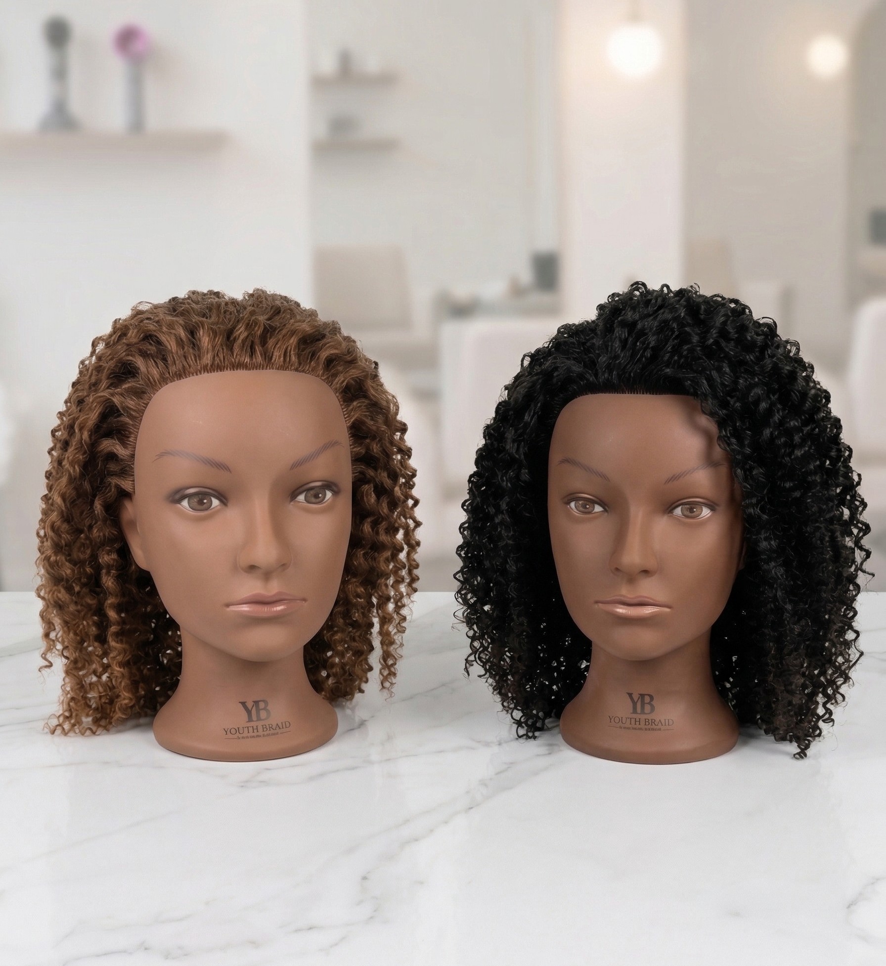 Two Youth Braid practice mannequin heads