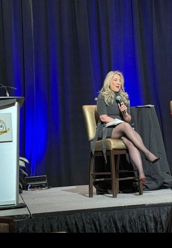 Jennifer Brady speaking at a professional event