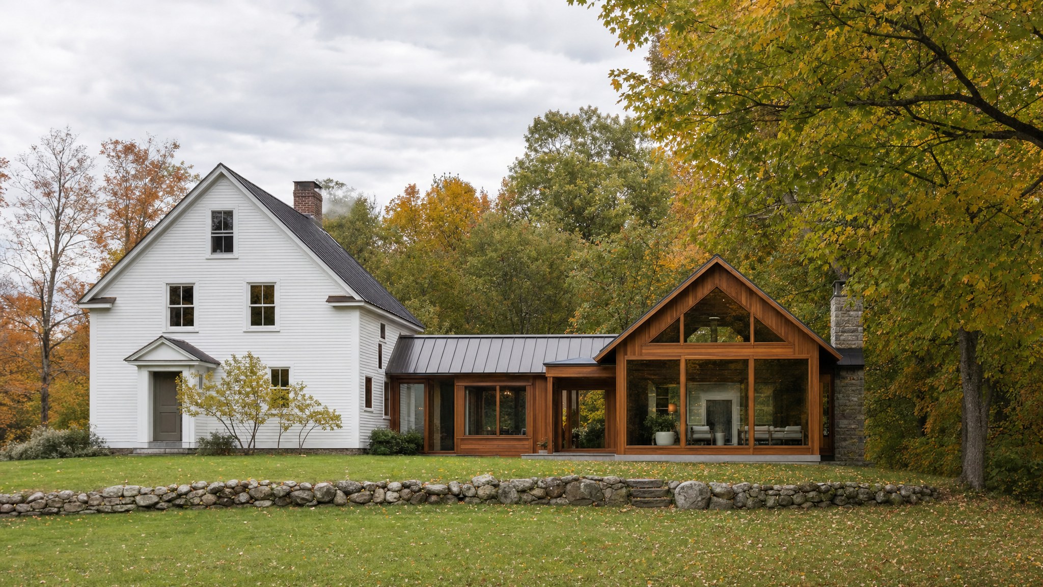 A Vermont farmhouse joined to a warm timber and glass renovation